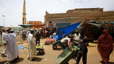 Sudanese vendors sell vegetables in the central market of Khartoum. The African country secured debt relief from the IMF, which will help pave the way for financial assistance from 22 countries at an upcoming conference in Paris in July. AFP