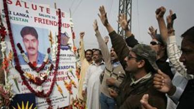 Crowds pay their respects at a memorial to Tanveer Iqbal, one of the traffic officers killed in the Lahore attack.