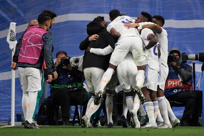 Real Madrid's players celebrate after Benzema's goal. AFP
