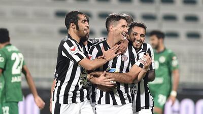 Thiago Neves, centre, and Al Jazira left Maktoum bin Rashid Stadium a happy bunch after a 2-1 win over Al Shabab. Courtesy AGL