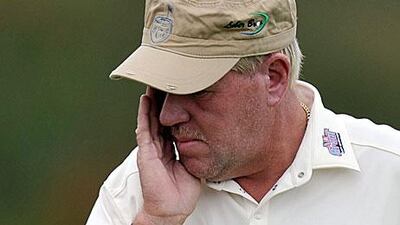 John Daly was apparently upset after receiving a penalty on the 10th hole when he hit the wrong ball out a bunker.
