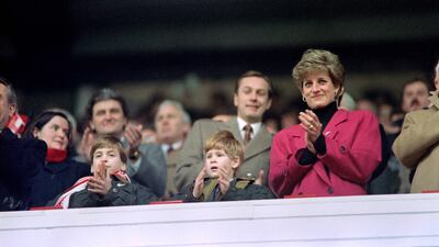 Princes William and Harry applaud alongside their mother, Princess Diana, during a Five Nations rugby match between Wales and France in 1992. AFP