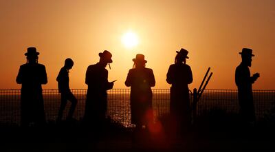 Ultra-Orthodox Jewish men and children in the coastal city of Netanya on September 14. AFP