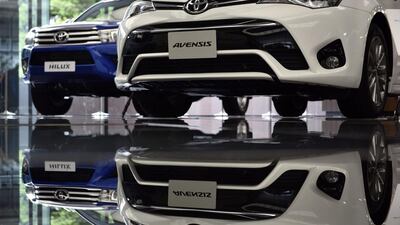 oyota vehicles on display at the company's Tokyo headquarters. A strong yen and falling US sales have hammered profits. Franck Robichon / EPA