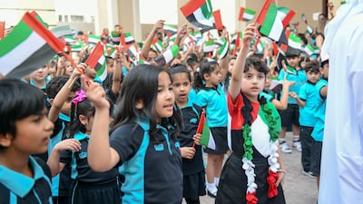 More than 2,000 pupils took part in a flag-hoisting ceremony at British International School in Abu Dhabi. Khushnum Bhandari / The National