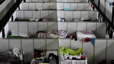 Accommodation provided to refugees at the former Tempelhof airport in Berlin as Germany tried to cope with a massive influx of people fleeing the Syrian civil war last year. Tobias Schwarz / AFP / December 9, 2015