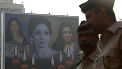 A poster of Sridevi with a condolence message hangs outside the actors residence in Mumbai. Divyakant Solanki / EPA