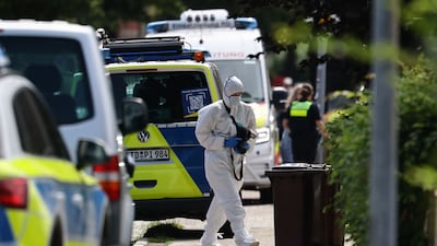 A forensics police officer at the scene in Stade, northern Germany, where five people were killed in a shooting. AFP