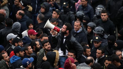 Tunisian protesters during a demonstration after the government announced tax hikes and austerity measures. EPA