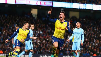 Olivier Giroud, centre, of Arsenal celebrates after he scores their second goal during a Premier League match against Manchester City at Etihad Stadium on January 18, 2015 in Manchester, England. Michael Steele/Getty Images