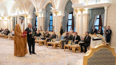 Sheikh Mohamed bin Zayed, Crown Prince of Abu Dhabi and Deputy Supreme Commander of the UAE Armed Forces, and Jair Bolsonaro, President of Brazil, witness the signing of a number of agreements between their countries at the Presidential Palace in Abu Dhabi on Sunday. Courtesy Sheikh Mohamed bin Zayed Twitter