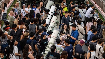 Observers look through telescopes at Princess Sirindhorn AstroPark in Chiang Mai, Thailand. Getty Images