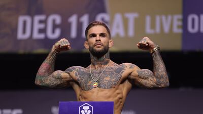LAS VEGAS, NEVADA - DECEMBER 10: Cody Garbrandt poses on the scale during the UFC 269 ceremonial weigh-in at MGM Grand Garden Arena on December 10, 2021 in Las Vegas, Nevada. Carmen Mandato / Getty Images / AFP