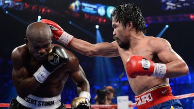 Manny Pacquiao lands a right to the head of Timothy Bradley in 2012. Getty