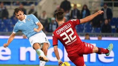 Lazio's Miroslav Klose shoots and scores a goal, one of his two in a 4-2 victory against Cagliari in Serie A on Monday night in Rome. Maurizio Brambatti / EPA / November 3, 2014