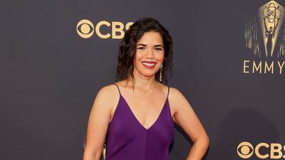 America Ferrera in a flowing purple gown with spaghetti straps. AP