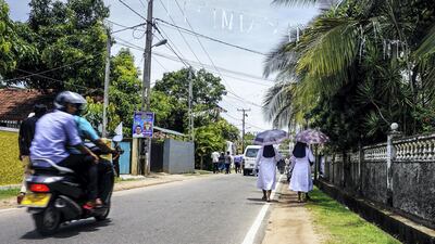 Catholic nuns walk down the street away from St Sebastian’s Church in Negombo, Sri Lanka, April 23, 2019. Jack Moore / The National