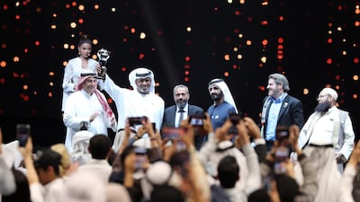 Winner Ahmed Al Falasi with Sheikh Mohammed bin Rashid Al Maktoum. Chris Whiteoak / The National