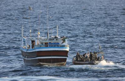 A handout photo, made available by the Royal Australian Navy on December 30 2017, of HMAS Warramunga's boarding team as it prepares to board a vessel of interest, later finding narcotics on-board. EPA