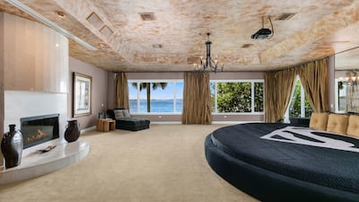 . The 900-square-foot bedroom has a 15-foot round bed, custom-created for his 7-foot-plus frame