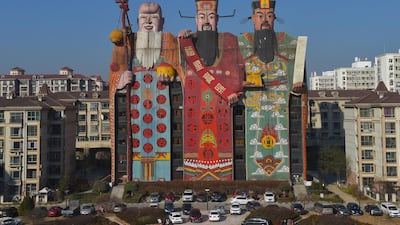 A hotel with its exterior featuring Chinese deities Fu, Lu and Shou, which symbolise happiness, prosperity and longevity, in Langfang, Hebei province / Reuters