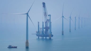 Wind turbines in China. Rising demand has slowed down progress on energy efficiency, says the head of the UN’s renewable energy agency. AFP