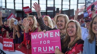 Women voters show their support for the President-elect as he arrives to speak during a campaign rally on November 4, in Raleigh, North Carolina. AP