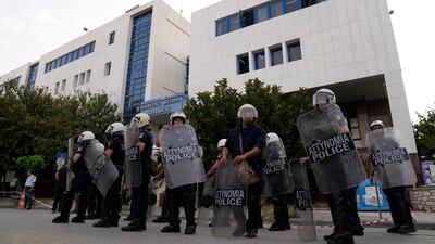 Police guard the courthouse in Kalamata. AP