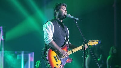 Arijit Singh performs at the Dubai World Trade Center Arena on Friday. Antonie Robertson / The National