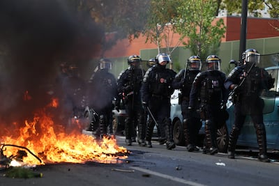 French students set fires as they clash with police during a march through the streets of Aubervilliers. Getty Images