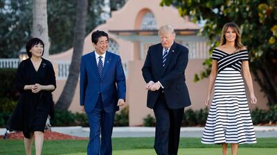 Shinzo Abe, centre left, and his wife Akie Abe, left, US President Donald Trump and first lady Melania Trump at Mr Trump's private Mar-a-Lago club, in Palm Beach, Florida on April 17, 2018. Prime Minister Abe said Friday, Aug. 28, 2020, he will step down due to his health. Pablo Martinez Monsivais / AP