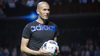 Former French soccer player Zinedine Zidane presents the official Euro 2016 soccer ball, dubbed 'Beau Jeu' (Beautiful Game) during a media event in Saint-Denis, outside Paris, France, 12 November 2015. EPA/IAN LANGSDON