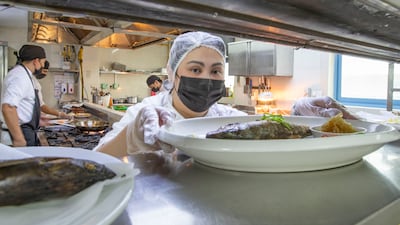 Feby Baguisa at work in the kitchen. She's also the head chef.
