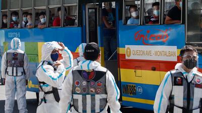Bus passengers look out at government transportation inspectors along Commonwealth Avenue in Quezon City, Metro Manila, Philippines. EPA