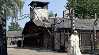 Pope Francis walks through the entrance of the former Nazi death camp of Auschwitz in Oswiecim, Poland on a visit to the Nazi concentration camp Auschwitz-Birkenau 29 July, 2016. Janek Skarzynski / AFP