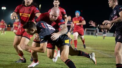 Dubai Exiles wing Schalk du Preez is tackled.