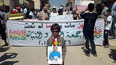 Anti-Assad protesters rally against the regime in Amude in August.