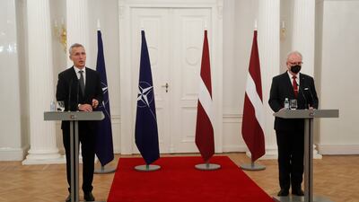 Nato Secretary General Jens Stoltenberg, left, and Latvian President Egils Levits after their meeting in Riga, Latvia, on Monday. EPA