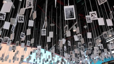 Polaroids of the chef, his staff and diners are placed above the bar. Chris Whiteoak / The National