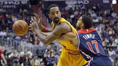 Washington Wizards guard Garrett Temple (17) knocks the ball away from Cleveland Cavaliers guard J.R. Smith (5) during the first half at Verizon Center. Tommy Gilligan/USA TODAY Sports