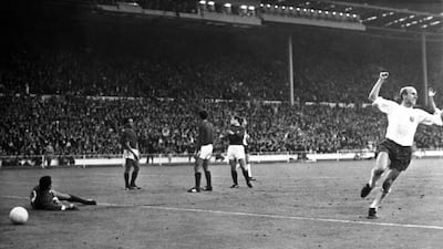 Bobby Charlton, right, scored twice for England during their semi-final win against Portugal in 1966. AP Photo