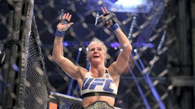 Holly Holm of the United States celebrates victory over Ronda Rousey. Getty
