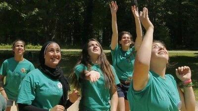 Jordanian, Egyptian and Israeli girls play volleyball at the Seeds of Peace summer camp in Otisfield, Maine. The camp is celebrating its 20th anniversary of bringing kids together from countries at conflict.