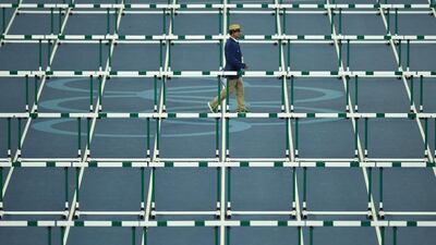A race official is pictured ahead of the Women’s 100m Hurdles Final during the athletics event at the Rio 2016 Olympic Games at the Olympic Stadium in Rio de Janeiro. Martin Bernetti / AFP