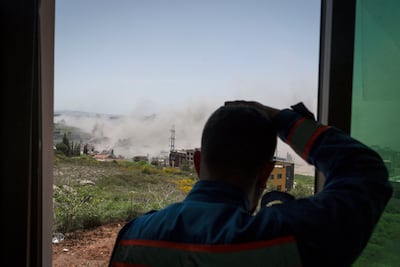 A paramedic surveys the damage wrought by an air strike in Nabatieh, Lebanon. Getty Images