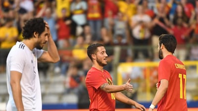 Eden Hazard, centre, celebrates with Belgium teammate Yannick Carrasco after scoring Belgium's second goal against Egypt at the King Baudouin Stadium in Brussels. Emmanuel Dunand / AFP