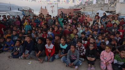 Displaced Palestinian children watch a film screening in Gaza city. AFP