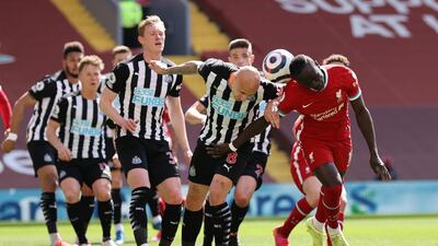 Newcastle's Jonjo Shelvey and Sadio Mane of Liverpool challenge for a header. Reuters