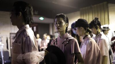 Models backstage before the Esa Liang collection show by Chinese designer BingQin Liang. Getty Images
