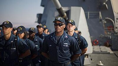 US Navy sailors stand in formation aboard the USS Stockdale before manoeuvres with the Jordanian Navy in the Gulf of Aqaba